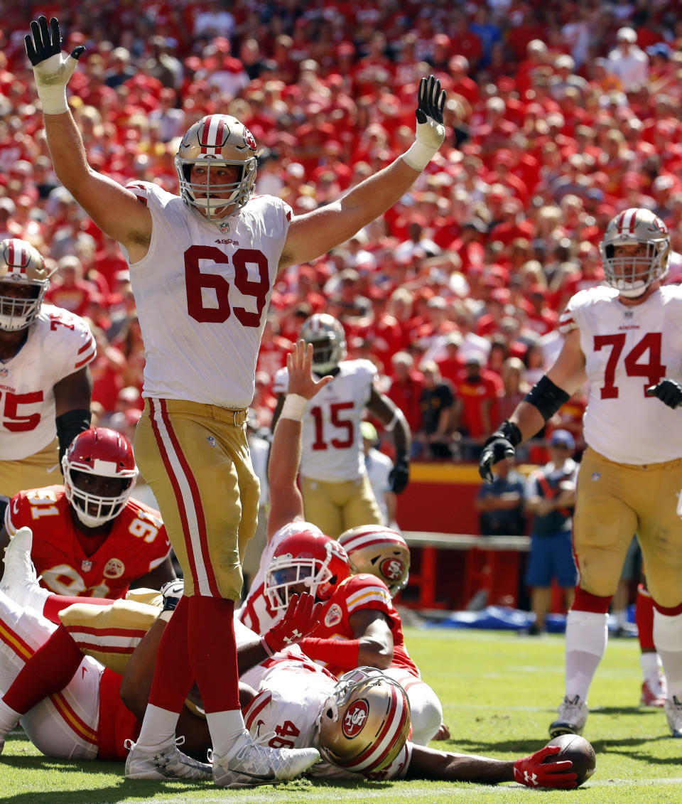 San Francisco 49ers offensive tackle Mike McGlinchey (69) celebrates as running back Alfred Morris (46) scores a touchdown during the first half of an NFL football game against the Kansas City Chiefs in Kansas City, Mo., Sunday, Sept. 23, 2018. (AP Photo/Charlie Riedel)