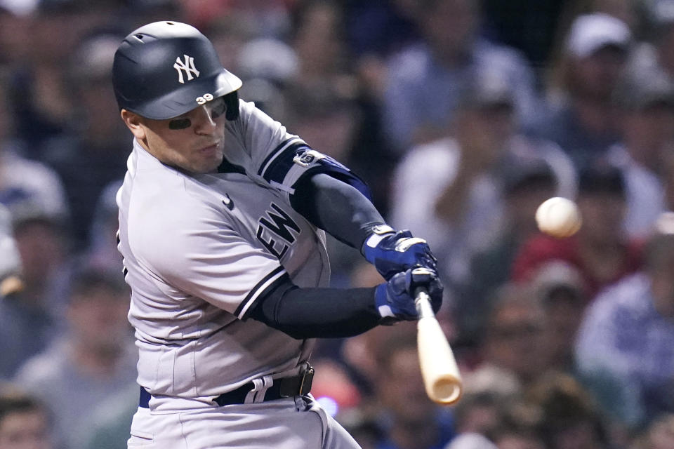 New York Yankees' Jose Trevino connects for an RBI double during the sixth inning of a baseball game against the Boston Red Sox at Fenway Park, Wednesday, Sept. 14, 2022, in Boston. (AP Photo/Charles Krupa)