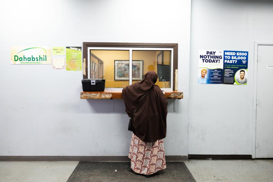 Abdullahi Kulmiye waits at the Dahabshil money order service at the Somali Community Self Management Agency in Salt Lake City on Thursday, Jan. 26, 2023. | Ryan Sun, Deseret News