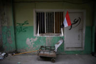 A flag of Iraq is seen outside a house on a street controlled by Iraqi Federal Police in western Mosul, Iraq, April 12, 2017. REUTERS/Andres Martinez Casares