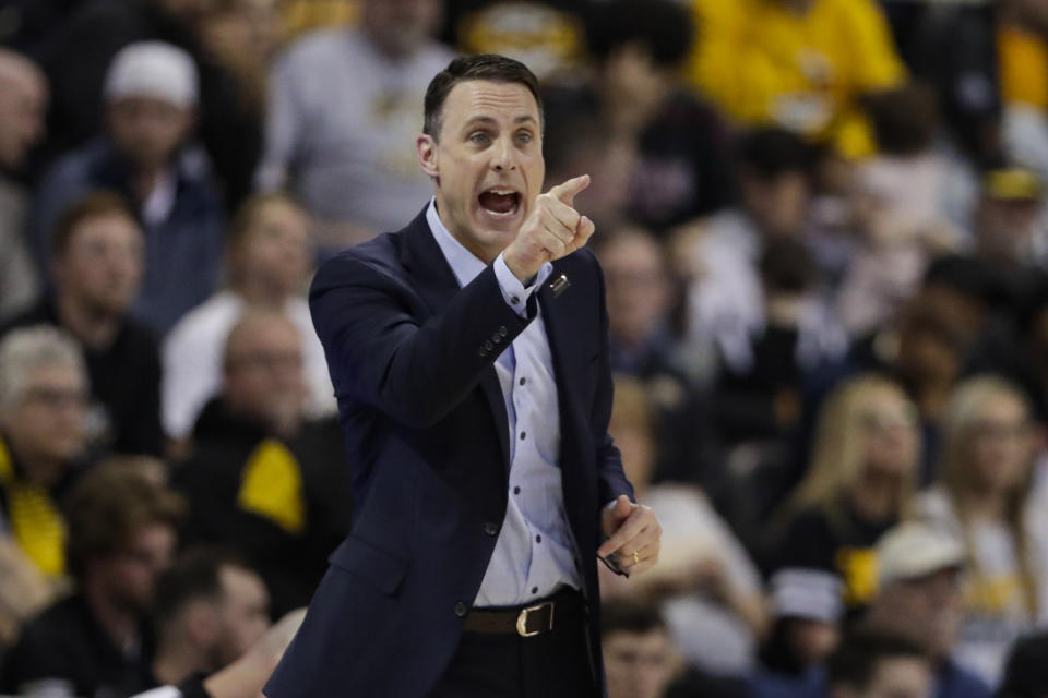 Northern Kentucky coach Darrin Horn gestures during the second half of the team's NCAA college basketball game against Illinois-Chicago for the Horizon League men's tournament championship in Indianapolis, Tuesday, March 10, 2020. Northern Kentucky won 71-62. (AP Photo/Michael Conroy)