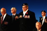 War veterans and military personell stand next to the Cenotaph at the Auckland War Memorial Museum for the ANZAC Day Dawn Service on April 25, 2012 in Auckland, New Zealand. Veterans, dignitaries and members of the public today marked ANZAC (Australia New Zealand Army Corps) Day, when First World War troops landed on the Gallipoli Peninsula, Turkey early April 25, 1915, commemorating the event with ceremonies of remembrance for those who fought and died in all wars. (Photo by Phil Walter/Getty Images)