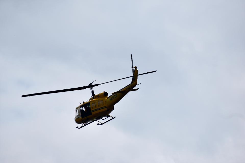 North Carolina Forest Service personnel observe the Juniper Road Two Fire in the Holly Shelter Game Lands in Pender County from a helicopter on Wednesday, Aug. 17, 2022.