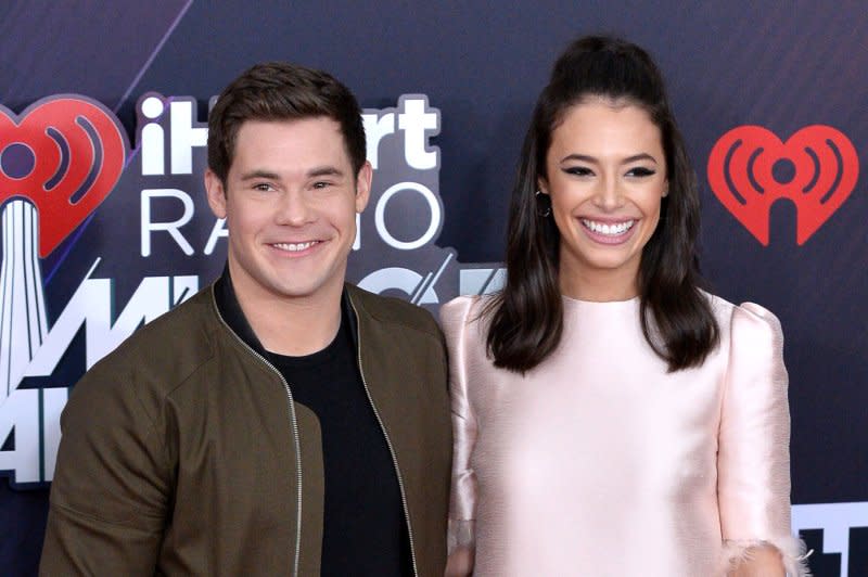 Adam Devine (L) and Chloe Bridges attend the iHeartRadio Music Awards in 2018. File Photo by Jim Ruymen/UPI