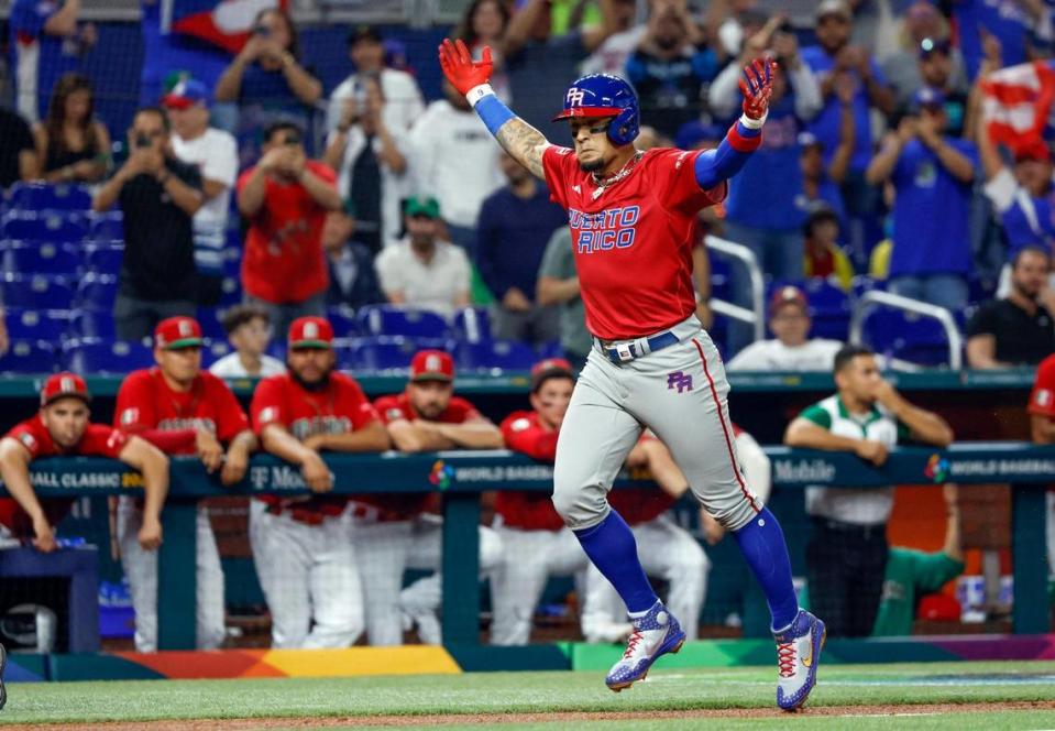 Puerto Rico second baseman Javier Baez (9) reacts after hitting a two run homer in the first inning against Mexico during the World Baseball Classic quarterfinal at Marlins Park in Miami on Friday, March 17, 2023.