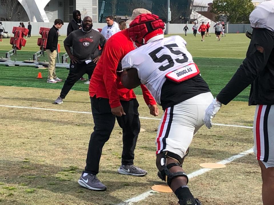 Georgia freshman defensive lineman Jamaal Jarrett during a drill as position coach Tray Scott looks on at practice on March 21, 2023