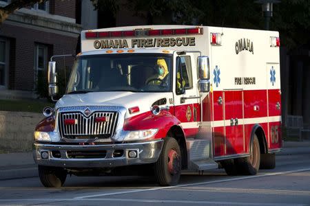 An ambulance transports Ashoka Mukpo, a freelance cameraman who contracted Ebola in Liberia, to the Nebraska Medical Center in Omaha, Nebraska, October 6, 2014. REUTERS/Sait Serkan Gurbuz