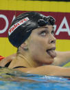 US swimmer Natalie Coughlin sticks her tongue out after she competed in the final of the women's 100-metre backstroke swimming event in the FINA World Championships at the indoor stadium of the Oriental Sports Center in Shanghai on July 26, 2011. She won bronze. AFP PHOTO / PETER PARKS (Photo credit should read PETER PARKS/AFP/Getty Images)
