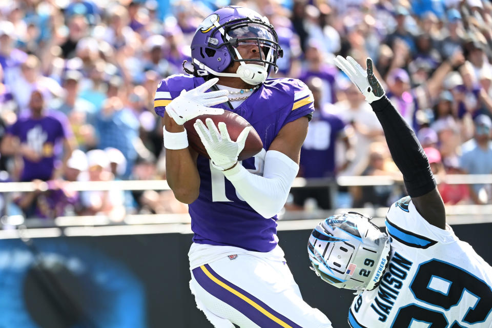 Oct 1, 2023; Charlotte, North Carolina, USA; Minnesota Vikings wide receiver Justin Jefferson (18) catches a touchdown pass as Carolina Panthers cornerback D’Shawn Jamison (29) defends in the third quarter at Bank of America Stadium. Mandatory Credit: Bob Donnan-USA TODAY Sports