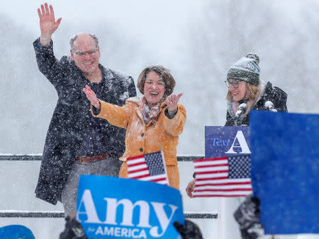 U.S. Senator Amy Klobuchar waves to the crowd with her husband John Bessler and daughter Abigail Bessler after announcing her candidacy for the 2020 Democratic presidential nomination in Minneapolis, Minnesota, U.S., February 10, 2019. REUTERS/Eric Miller