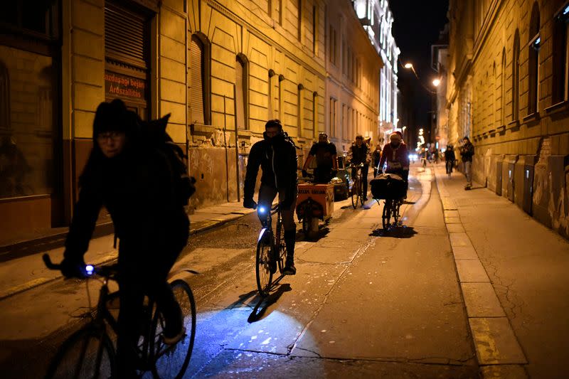 Hungary's "Budapest Bike Maffia" members distribute thousands of meals by bike to those in need