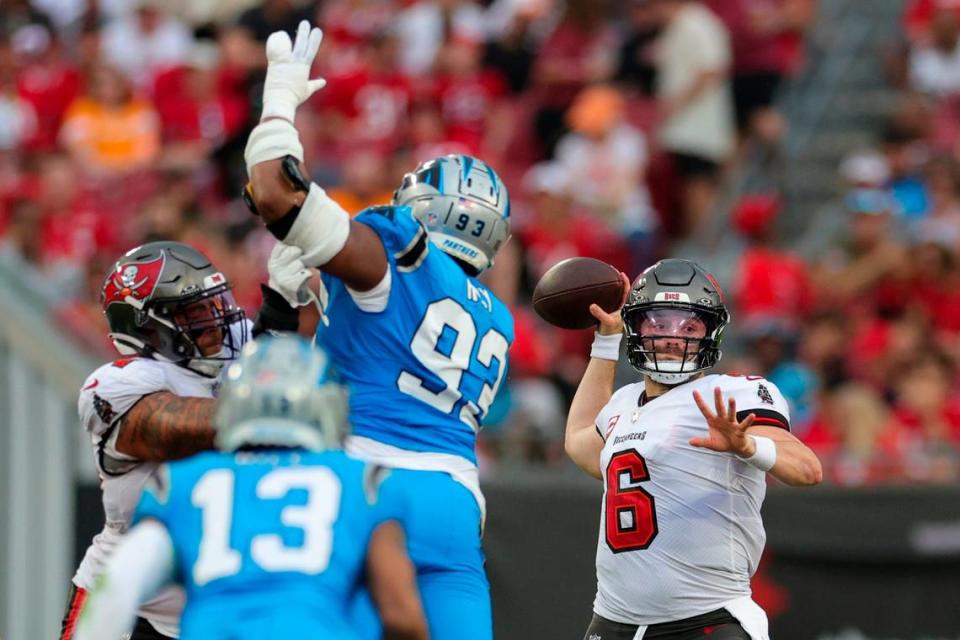 Dec 3, 2023; Tampa, Florida, USA; Tampa Bay Buccaneers quarterback Baker Mayfield (6) drops back to pass against the Carolina Panthers in the fourth quarter at Raymond James Stadium. Mayfield quarterbacked two wins for the Bucs over Carolina this season.