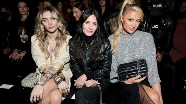 PHOTO: (L-R) Paris Jackson, Courteney Cox, and Paris Hilton attend Celine at The Wiltern, Dec. 08, 2022 in Los Angeles. (Matt Winkelmeyer/Getty Images for CELINE)