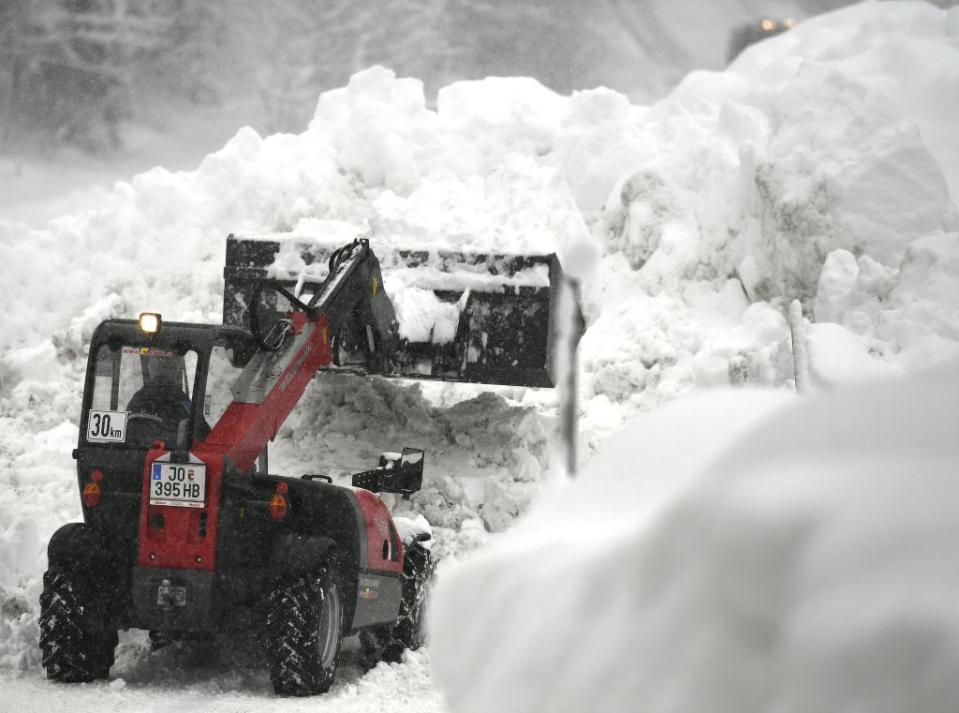 <em>Authorities have been trying to clear roofs and roads in southern Germany and Austria (Picture: Getty)</em>