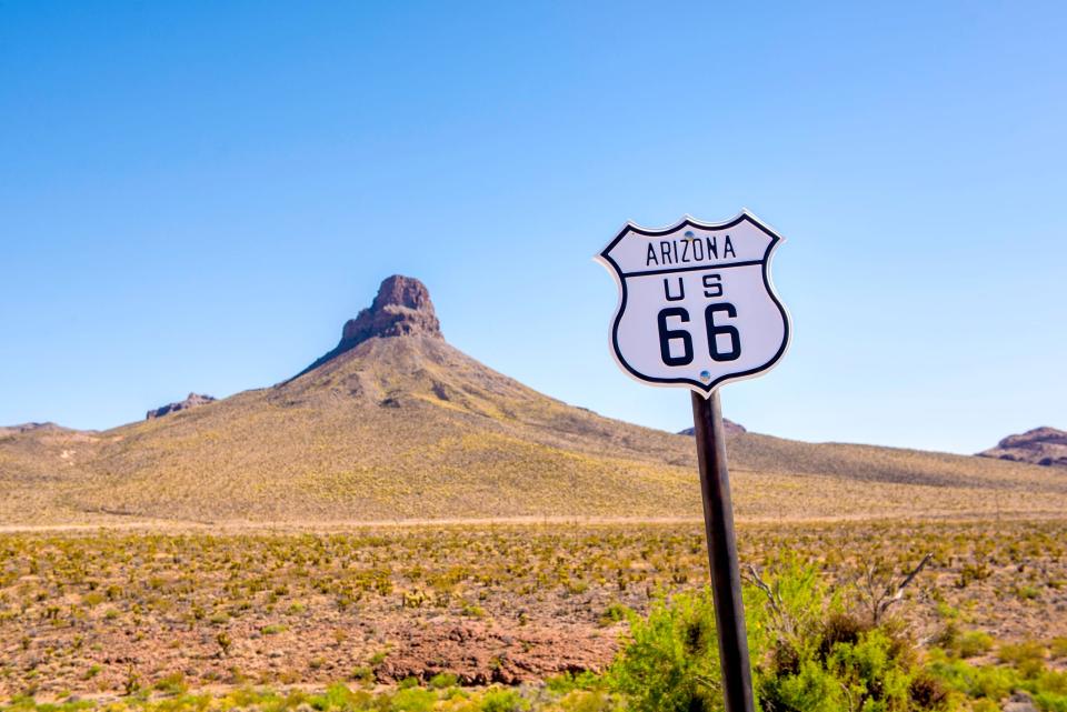 Route 66 sign on Oatman Road in rural Arizona.