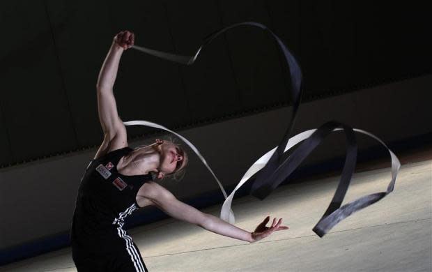 Austrian gymnast and Olympic hopeful Caroline Weber practices with the ribbon during a training session in Vienna April 19, 2012. Weber, 26, who practices six hours a day five days a week, will participate in the rhythmic gymnastics competition at the London 2012 Olympic games.