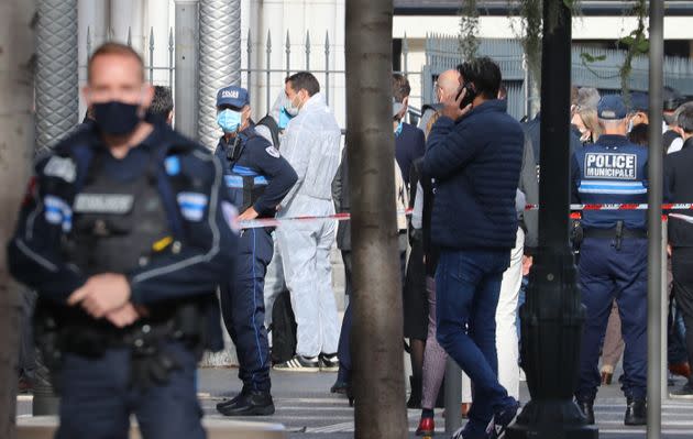 French forensics officers arrive at the site of a knife attack in Nice on October 29, 2020.