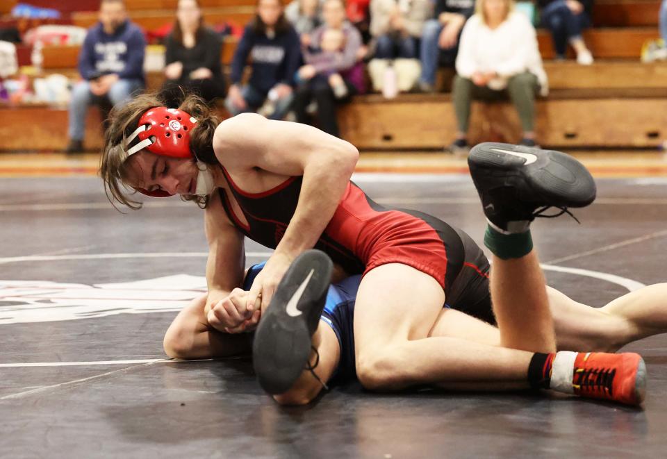 Brockton's Brandon Winn defeated Jack Sauer for the sectional championship during the division one south sectional wrestling championships at Brockton High School on Saturday, Feb. 11, 2023.