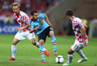 GDANSK, POLAND - JUNE 18: Jordi Alba of Spain is put under pressure by Ivan Rakitic and Darijo Srna of Croatia during the UEFA EURO 2012 group C match between Croatia and Spain at The Municipal Stadium on June 18, 2012 in Gdansk, Poland. (Photo by Michael Steele/Getty Images)