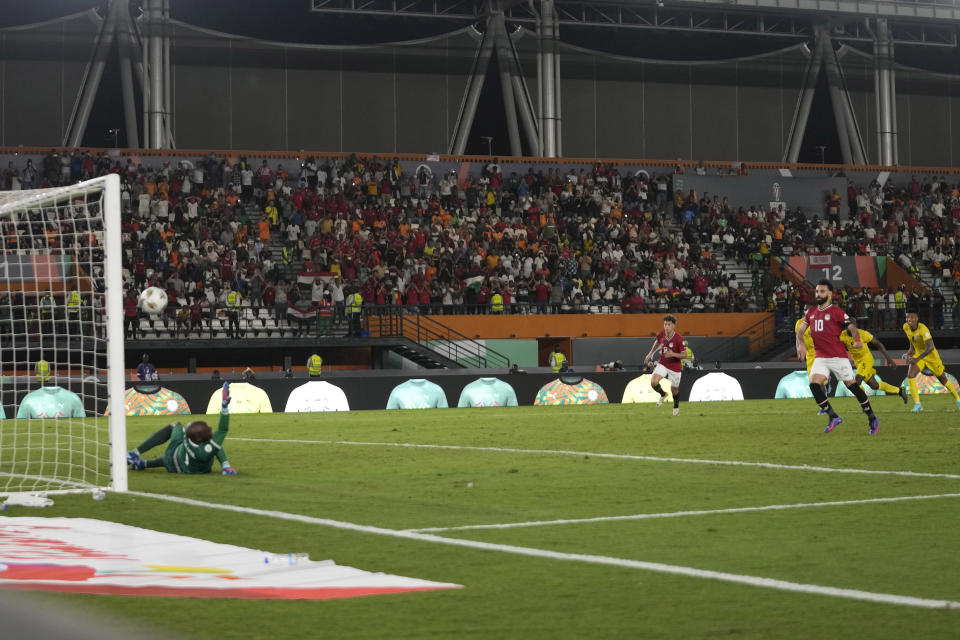 Egypt's Mohamed Salah shoots and score from the penalty spot his side second goal during the African Cup of Nations Group B soccer match between Egypt and Mozambique in Abidjan, Ivory Coast, Sunday, Jan. 14, 2024. (AP Photo/Themba Hadebe)