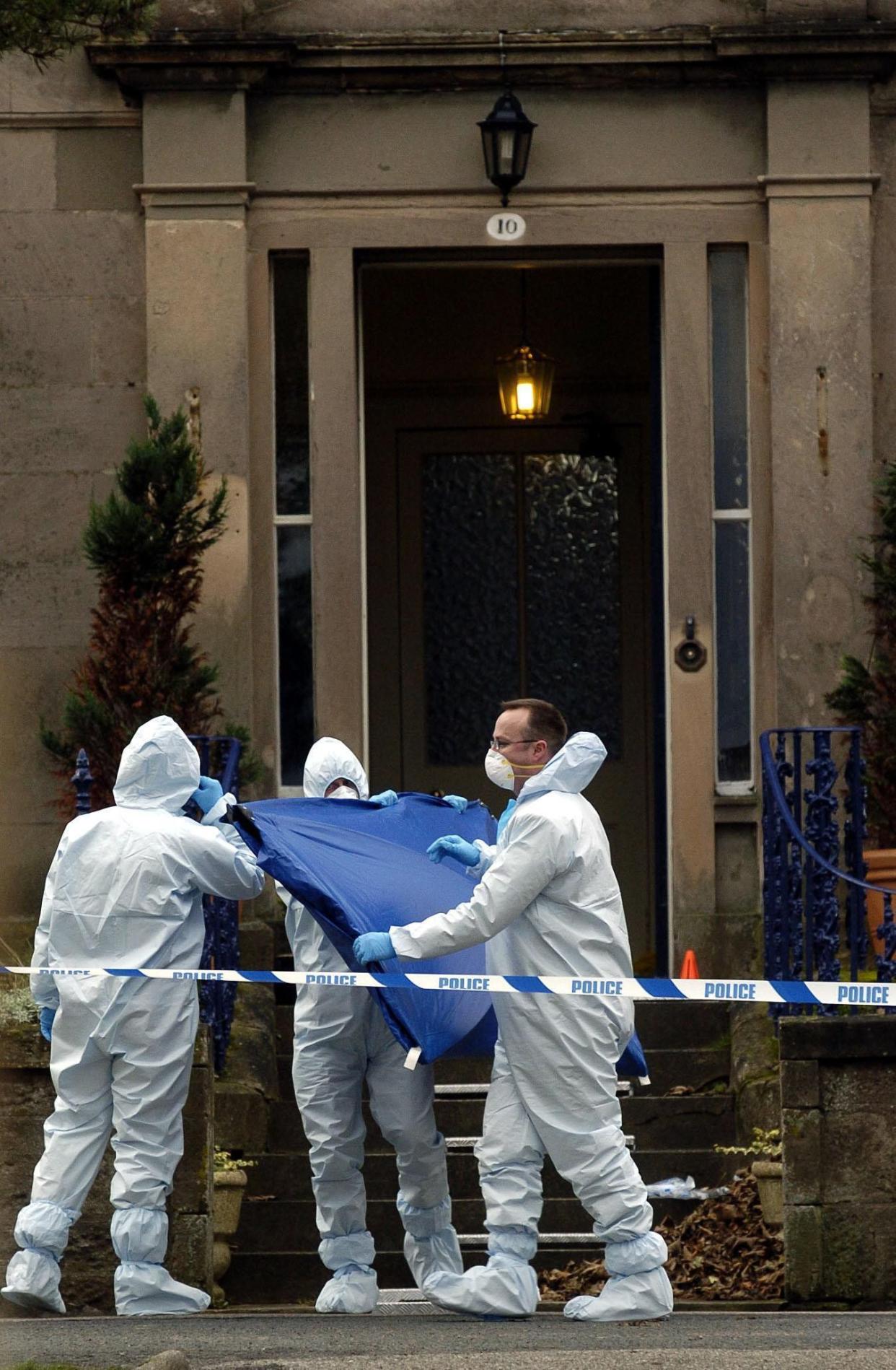 A police forensic team at the scene of the 'doorstep murder'