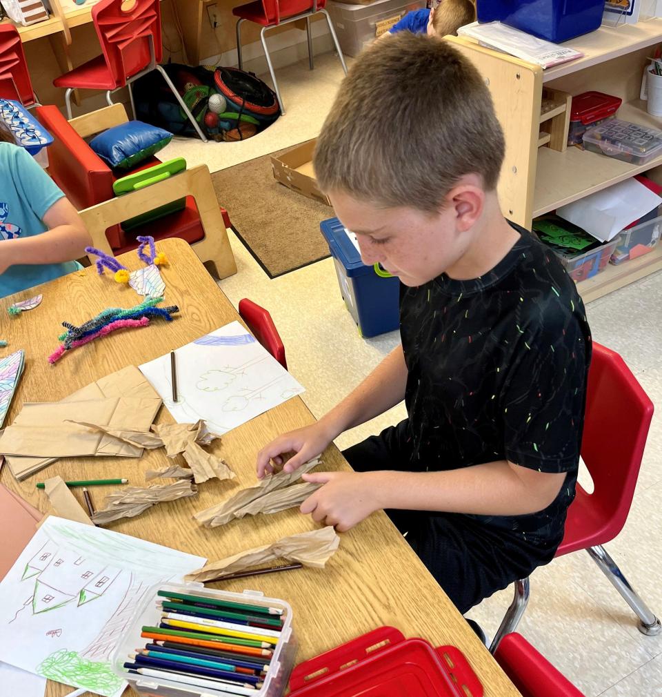 A student works on a project as part of the program.