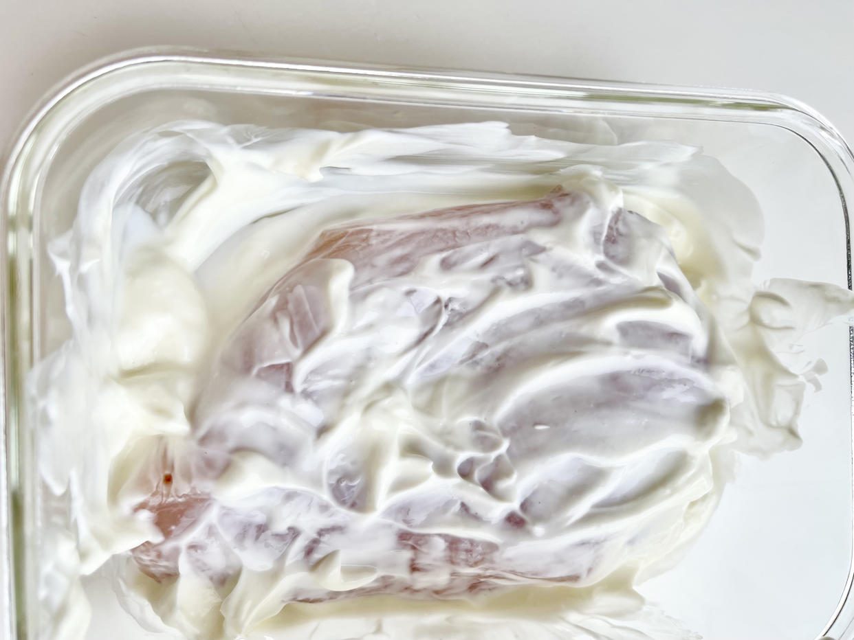 The lactic acid in the yogurt tenderizes the chicken breast. (Ali Rosen)