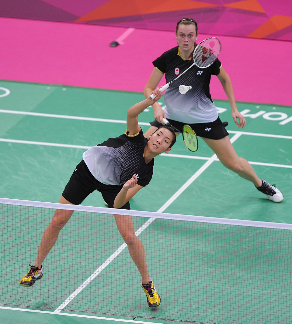 LONDON, ENGLAND - AUGUST 01: Alex Bruce (bottom) and Michelle Li (top) of Canada return against Leanne Choo and Renuga Veeran of Australia in their Women's Doubles Badminton on Day 5 of the London 2012 Olympic Games at Wembley Arena at Wembley Arena on August 1, 2012 in London, England. (Photo by Michael Regan/Getty Images)