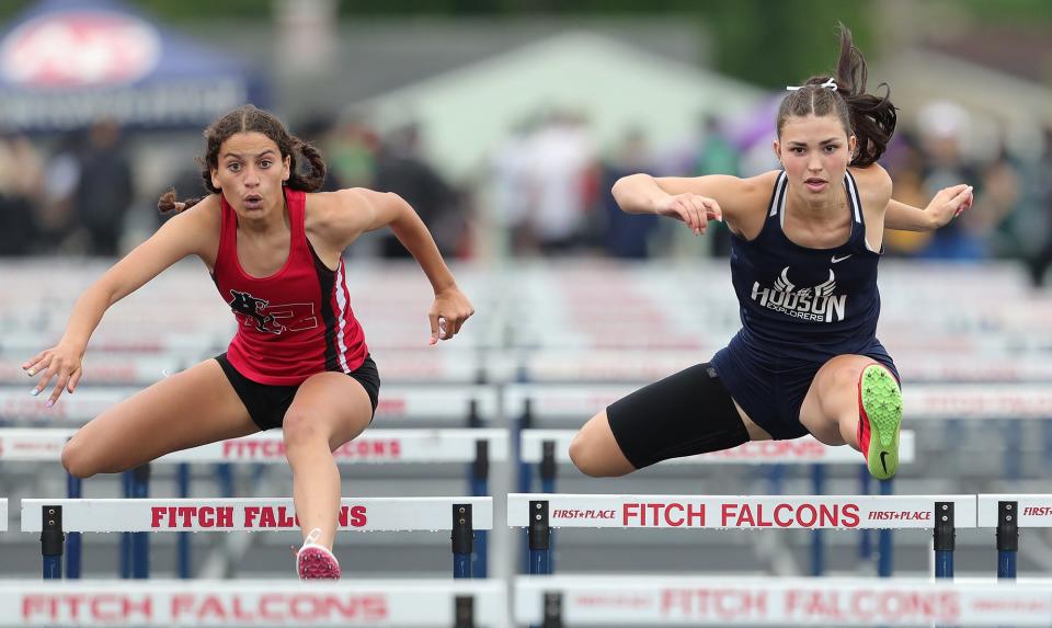 Hudson's Klaudia Kosa, right, competes against Kent Roosevelt's Lea Parham in the girls 100-meter hurdles during the Division I regional track and field meet at Austintown Fitch High School on Friday.