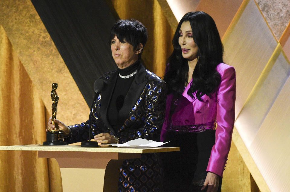 Diane Warren, left, and Cher speak on stage during the Governors Awards on Saturday, Nov. 19, 2022, at Fairmont Century Plaza in Los Angeles. (Photo by Richard Shotwell/Invision/AP)