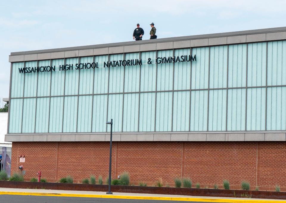 Security on the roof of Wissahickon High School ahead of the campaign rally for Vice President Kamala Harris, where Pennsylvania Governor Josh Shapiro and Michigan Governor Gretchen Whimer are due to speak, in Ambler on Monday, July 29, 2024.