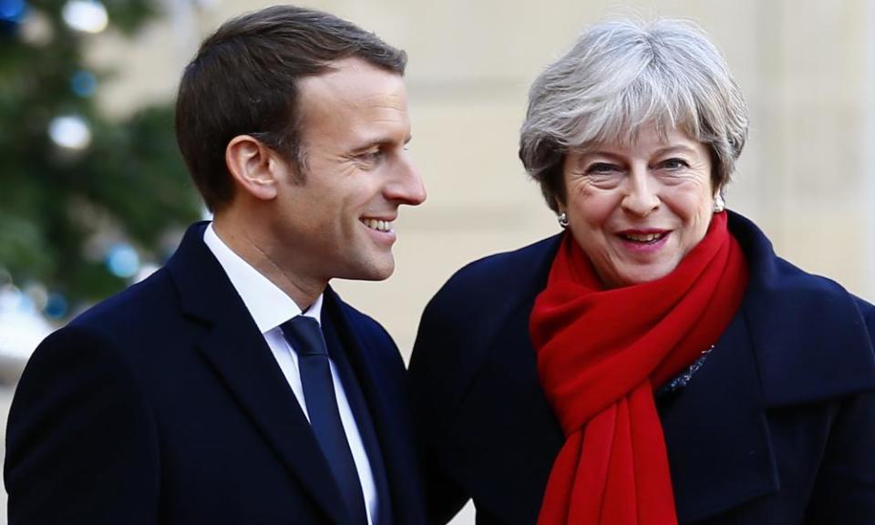 Theresa May is welcomed by President Emmanuel Macron before a lunch at the Élysée Palace in Paris on Tuesday.