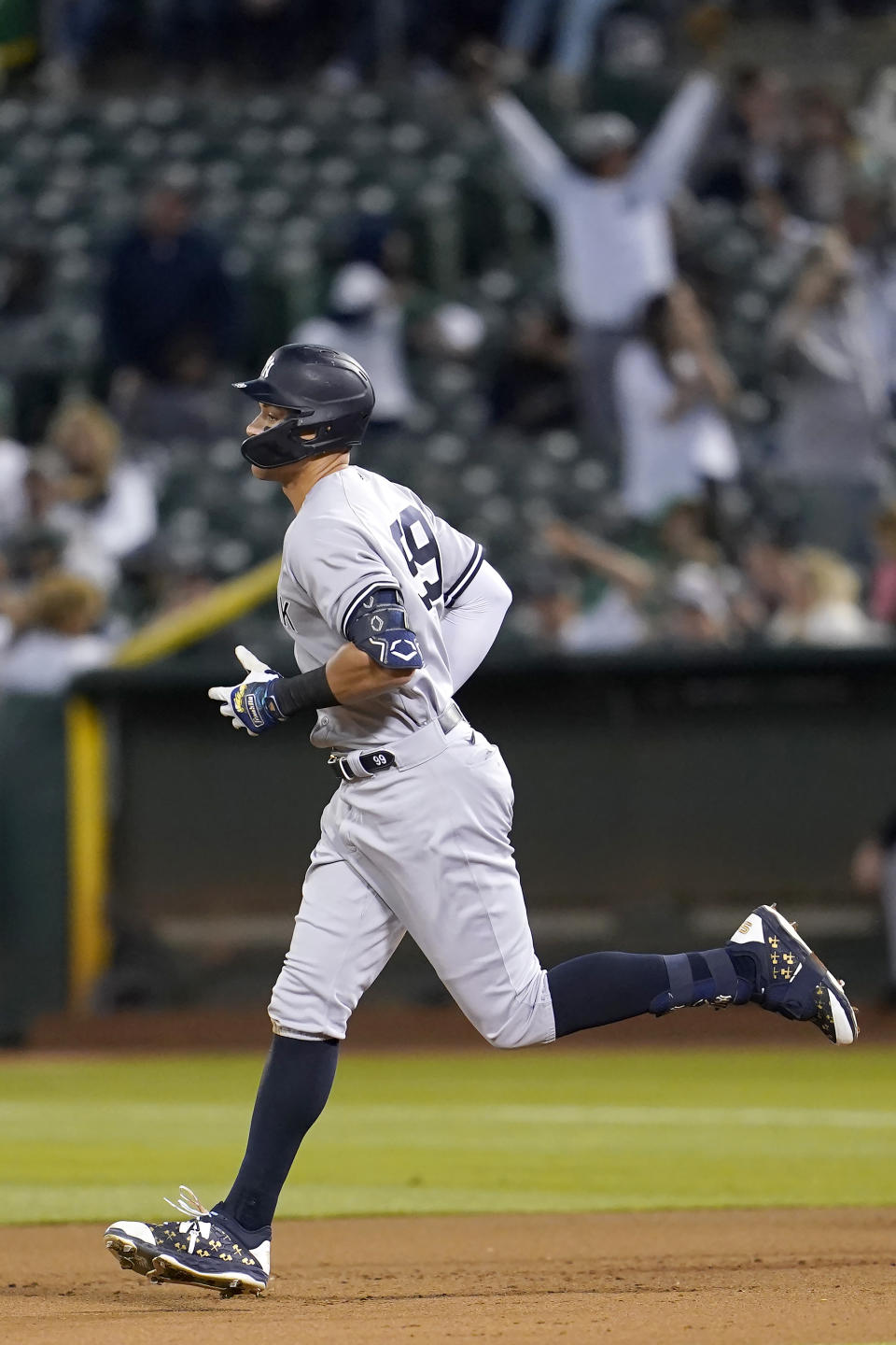 New York Yankees' Aaron Judge rounds the bases after hitting a three-run home run against the Oakland Athletics during the fifth inning of a baseball game in Oakland, Calif., Friday, Aug. 26, 2022. (AP Photo/Jeff Chiu)