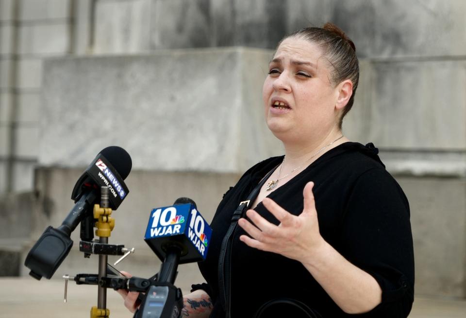 Melissa Grussi, a tenant at a Pioneer Investments property, describes her constant issues with her landlord during a tenants' rally Tuesday at the State House.