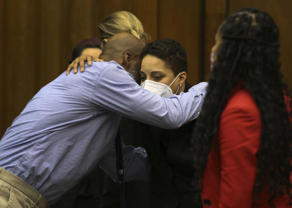 Lamar Johnson, left, embraces St. Louis Prosecutor Kim Garner on Tuesday, Feb. 14, 2023, after St. Louis Circuit Judge David Mason vacated his murder conviction during a hearing in St. Louis, Mo. Johnson served nearly 28 years of a life sentence for a killing that he has always said he didn't commit. (Christian Gooden/St. Louis Post-Dispatch via AP, Pool)