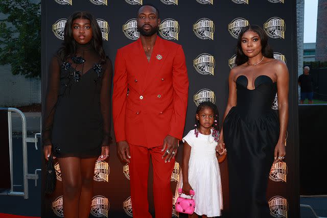 <p>Mike Lawrie/Getty </p> Dwyane Wade and family at Hall of Fame Induction ceremony