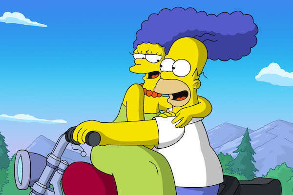 Marge (voiced by Julie Kavner) and Homer Simpson (voiced by Dan Castellaneta) riding on a motorcycle