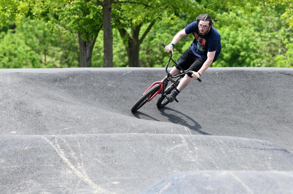 Cody Mullins of Alliance rides the new pump track which was recently opened for bike riders at Memorial Park. Tuesday, May 23, 2023.