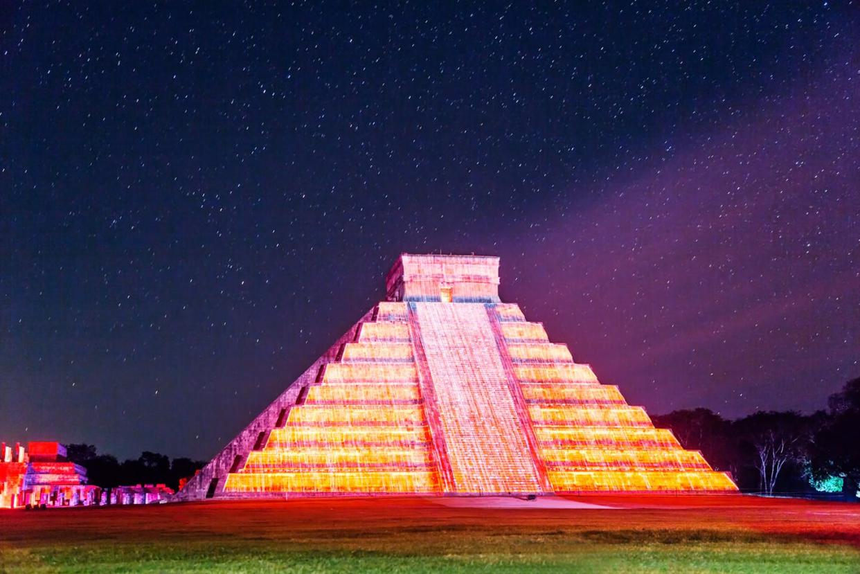 El Castillo pyramid illuminated at night under a starry sky in Chichen Itza, Mexico, one of the largest Maya cities. <a href="https://www.gettyimages.com/detail/photo/pyramid-under-a-starry-sky-chichen-itza-mexico-royalty-free-image/603211981?phrase=maya+astronomy&adppopup=true" rel="nofollow noopener" target="_blank" data-ylk="slk:Matteo Colombo/DigitalVision via Getty Images;elm:context_link;itc:0;sec:content-canvas" class="link ">Matteo Colombo/DigitalVision via Getty Images</a>