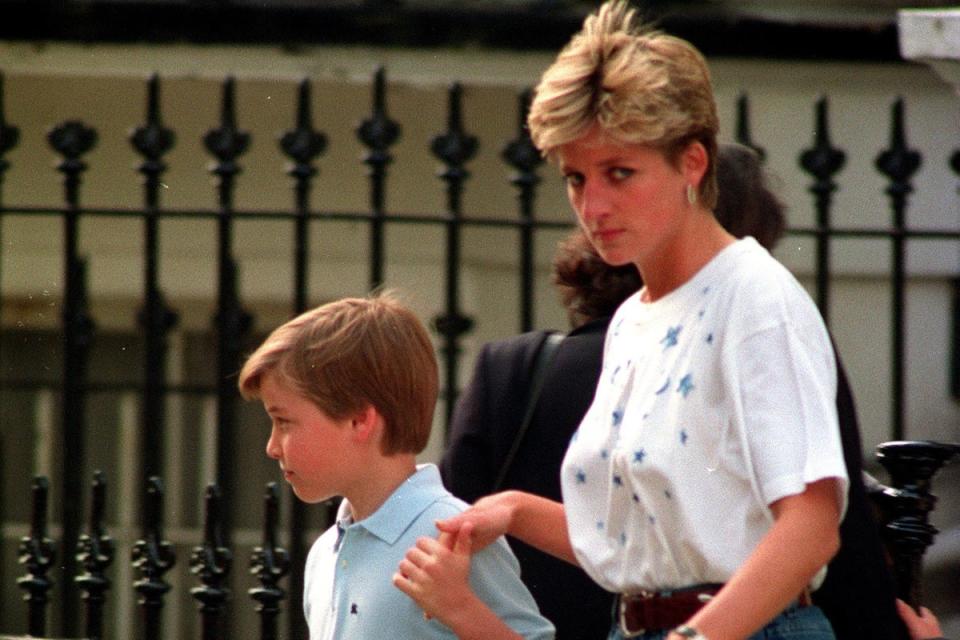 Diana, Princess of Wales, holds a young Prince William’s hand (Adam Butler/PA) (PA Archive)