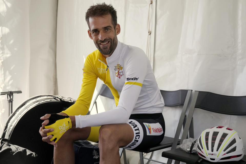 Vatican cyclist Rien Schuurhuis rests before the start of the men's elite road race at the world road cycling championships in Wollongong, Australia, Sunday, Sept. 25, 2022. (AP Photo/Rick Rycroft)