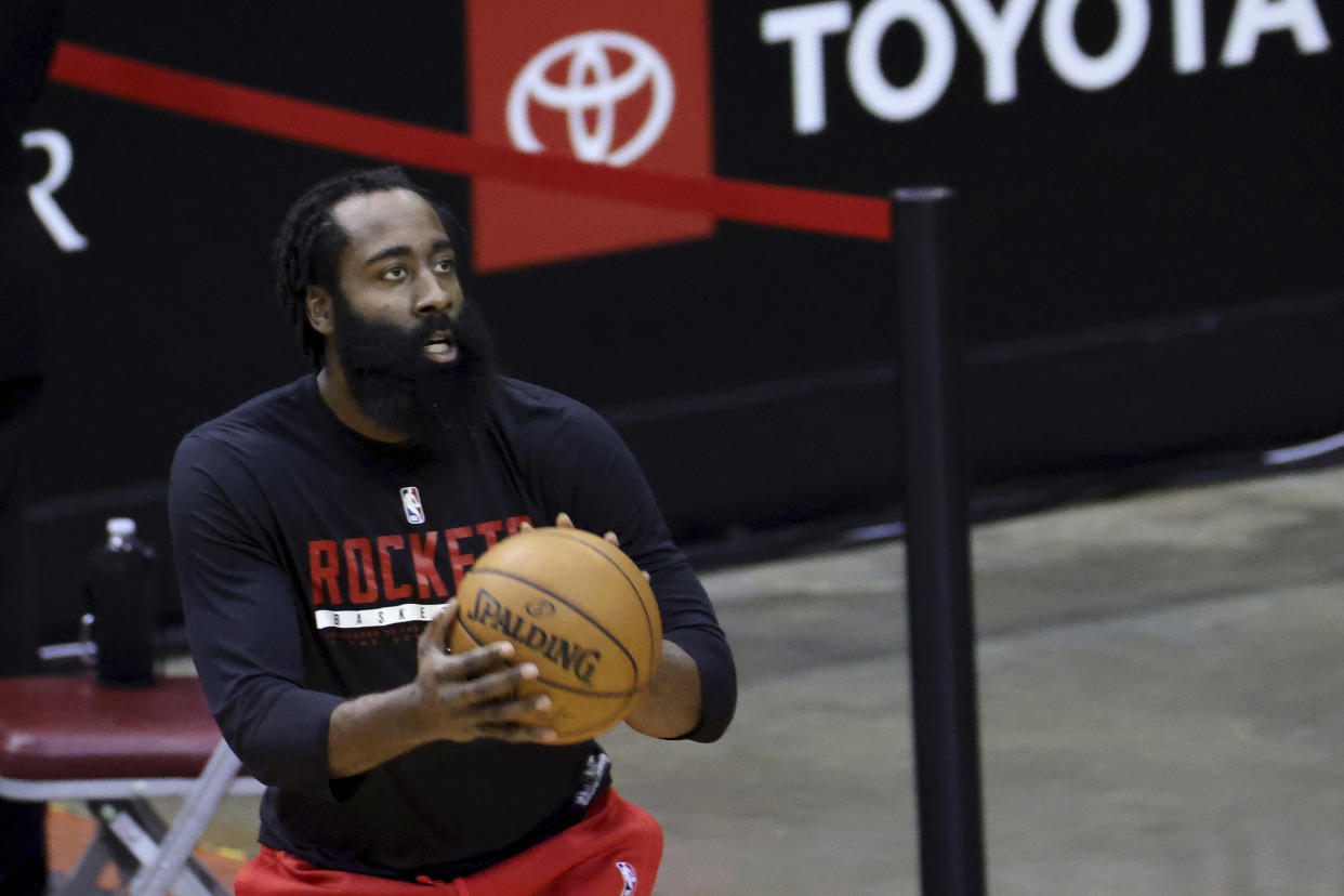 Houston Rockets' James Harden warms up prior to an NBA basketball game against the Los Angeles Lakers, Sunday, Jan. 10, 2021, in Houston. (Carmen Mandato/Pool Photo via AP)