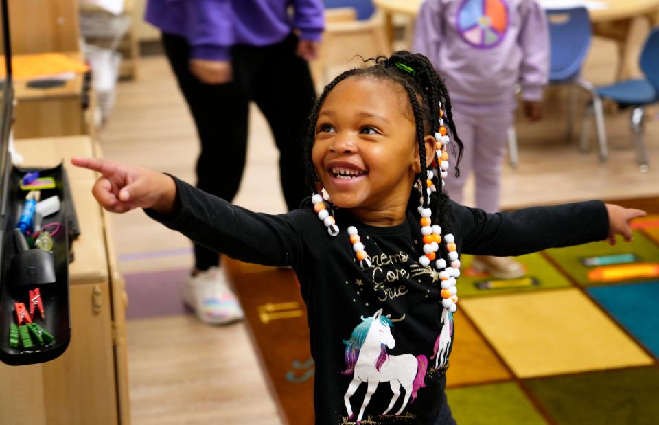 Ja’myrah, 4, finds the Elf on the Shelf during a freeze dance Dec. 11 at Cincinnati Children’s Hospital Therapeutic Interagency Program (TIP) in Walnut Hills, for severely traumatized children.