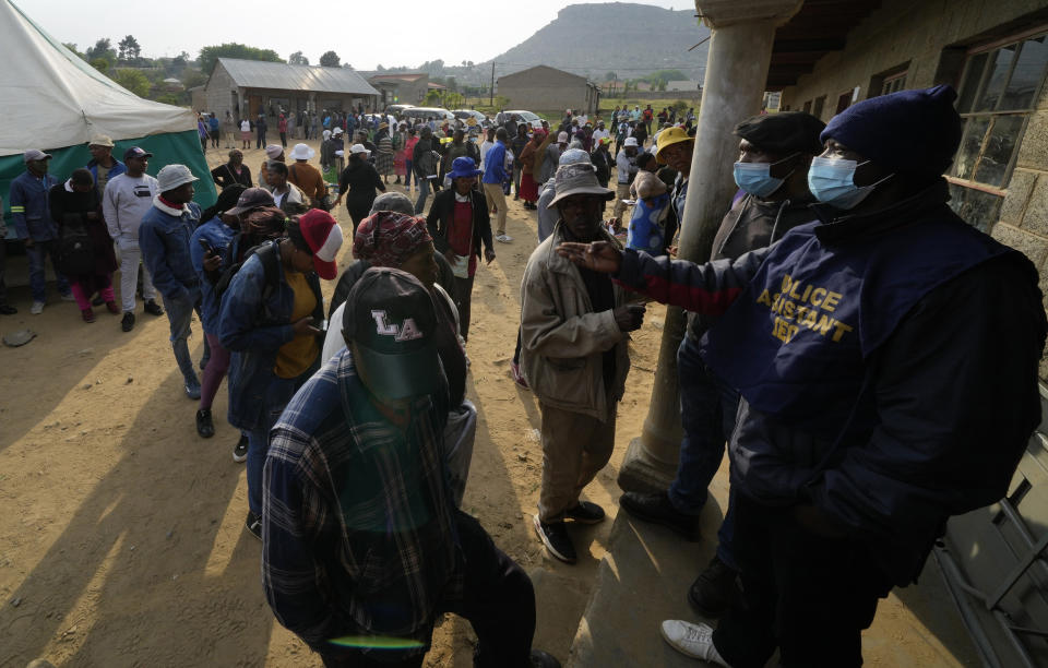 People line up to cast their votes at a polling station in Maseru, Lesotho, Friday, Oct. 7, 2022. Voters across the picturesque mountain kingdom of Lesotho are heading to the polls. (AP Photo/Themba Hadebe)