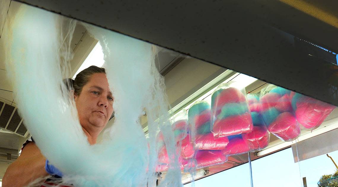 Wanda Lovelace makes cotton candy as she readies for opening day of the State Fair at the N.C. State Fairgrounds in Raleigh, N.C. Wednesday, October 14, 2015.