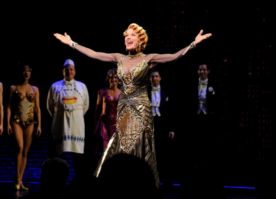 FILE - In this April 10, 2014 file photo, actor Marin Mazzie on stage during the curtain call for the opening night of "Bullets Over Broadway" in New York. Mazzie, who battled ovarian cancer starting in 2015, died Thursday, Sept. 13, 2018, at her Manhattan home, said her husband, actor Jason Danieley. She was 57. (Photo by Brad Barket/Invision/AP, File)