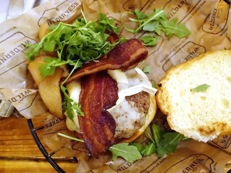 Apple and brie burger with green chile apple chutney, onion jam, brie cheese, arugula and bacon at Arizona Wilderness Brewing Co. in Gilbert.