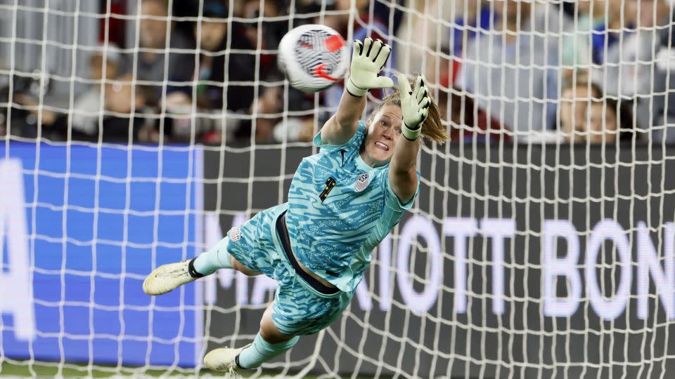 Alyssa Naeher makes a save during the shootout. - Jay LaPrete/AP