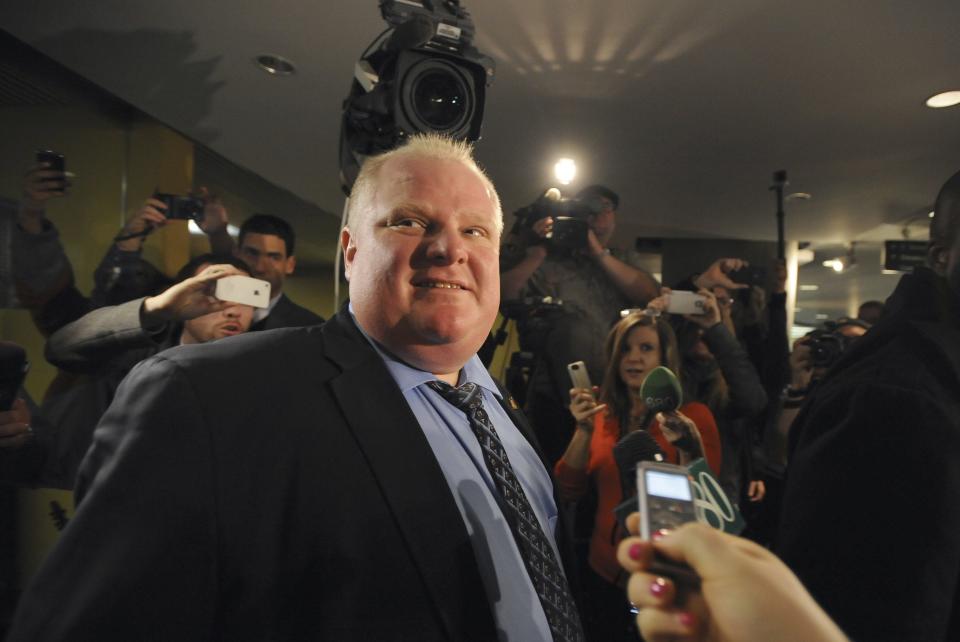 Toronto Mayor Rob Ford leaves his City Hall office after a day of city council meetings in Toronto November 15, 2013. Toronto city council voted to strip scandal-plagued Mayor Rob Ford of some of his powers on Friday but Ford, who admits he smoked crack cocaine while in office, promised to challenge the moves in court. REUTERS/Jon Blacker (CANADA - Tags: POLITICS CRIME LAW)