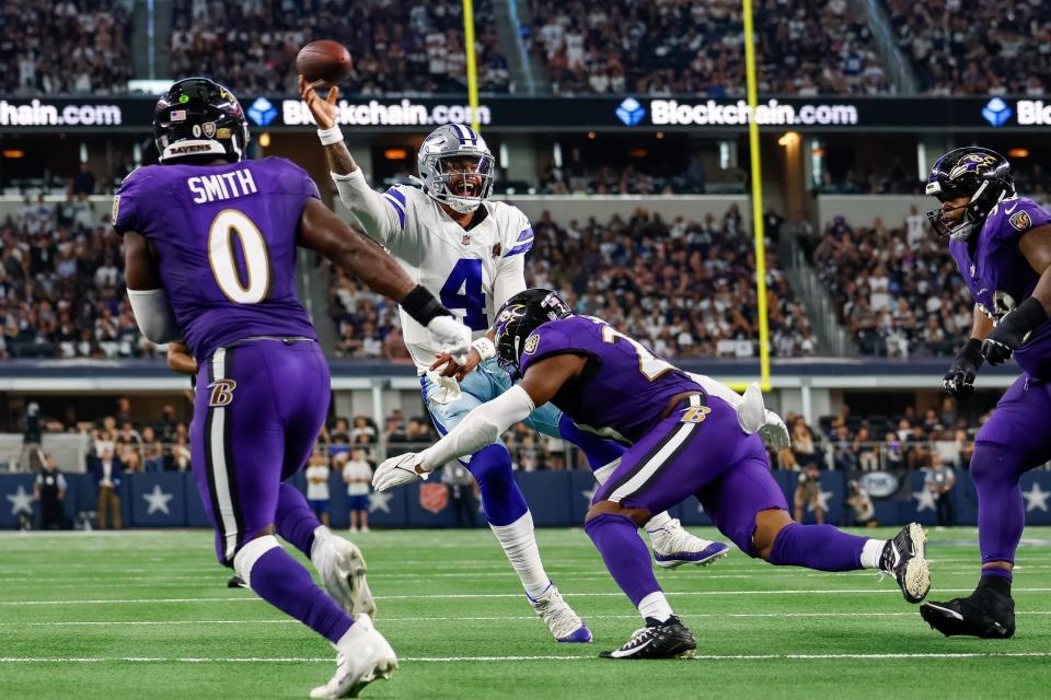 Sep 22, 2024; Arlington, Texas, USA; Dallas Cowboys quarterback Dak Prescott (4) is pressured on the 2 point attempt by Baltimore Ravens linebacker Trenton Simpson (23) during the fourth quarter at AT&T Stadium. Mandatory Credit: Andrew Dieb-Imagn Images